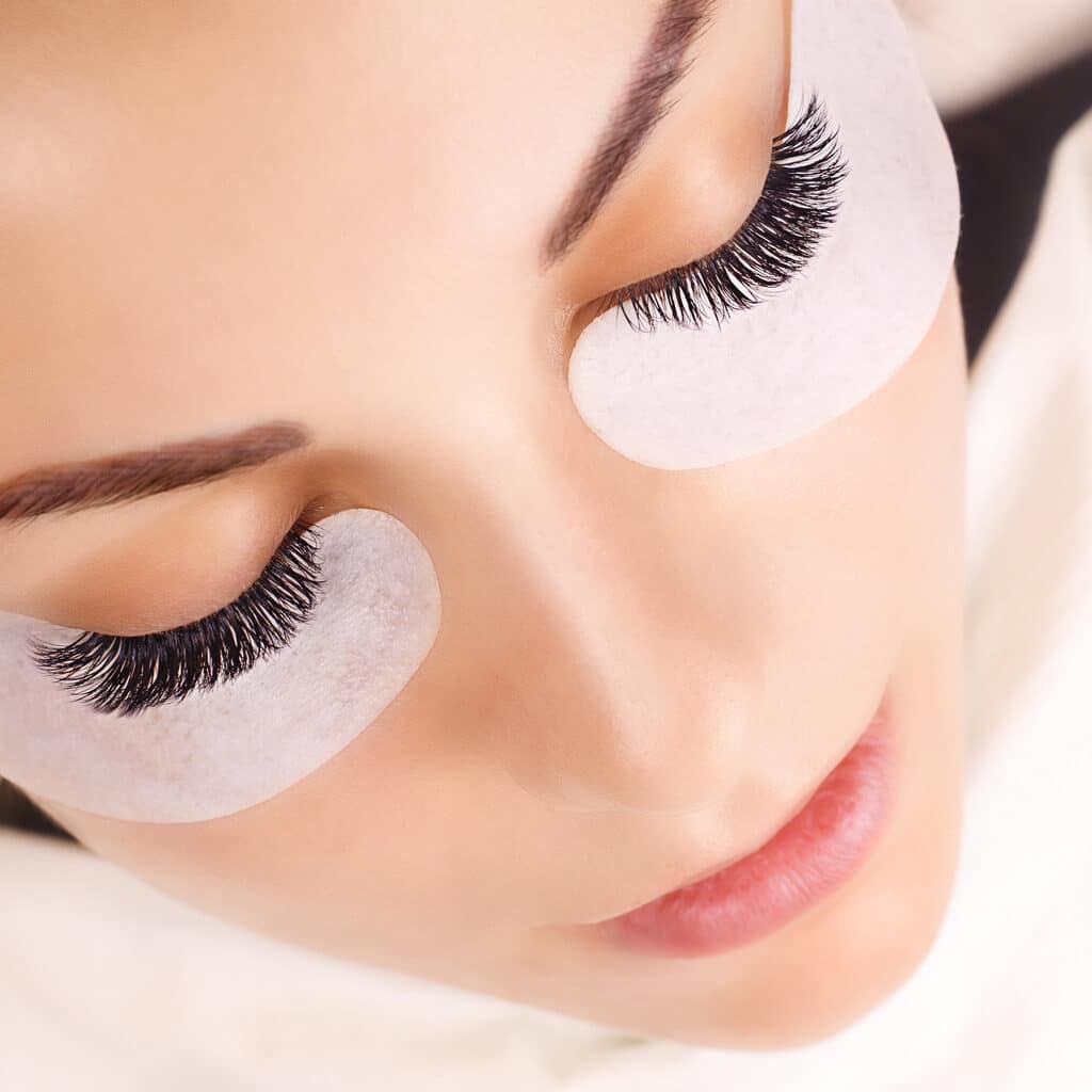 eyelash extension procedure woman eye with long eyelashes close up picture id1031432808