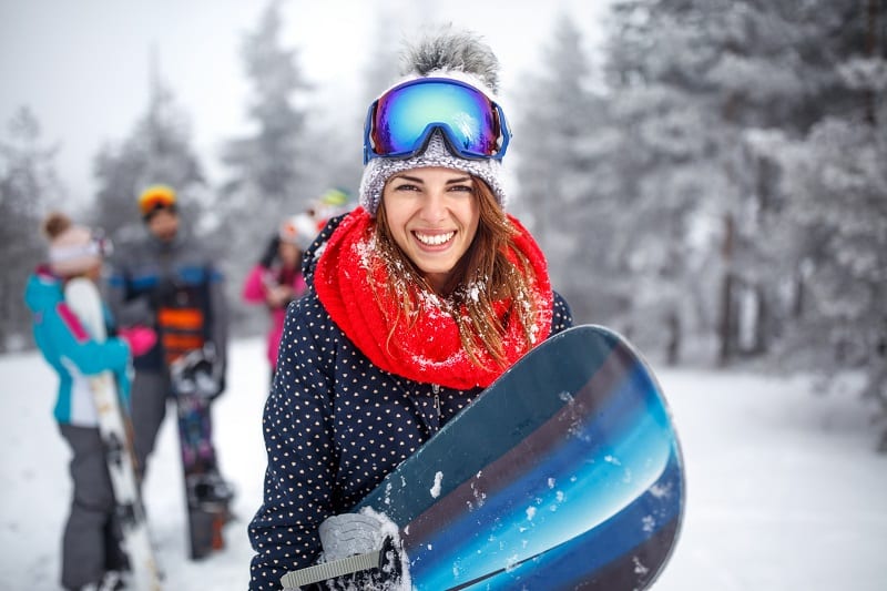Woman snowboarding after IV therapy