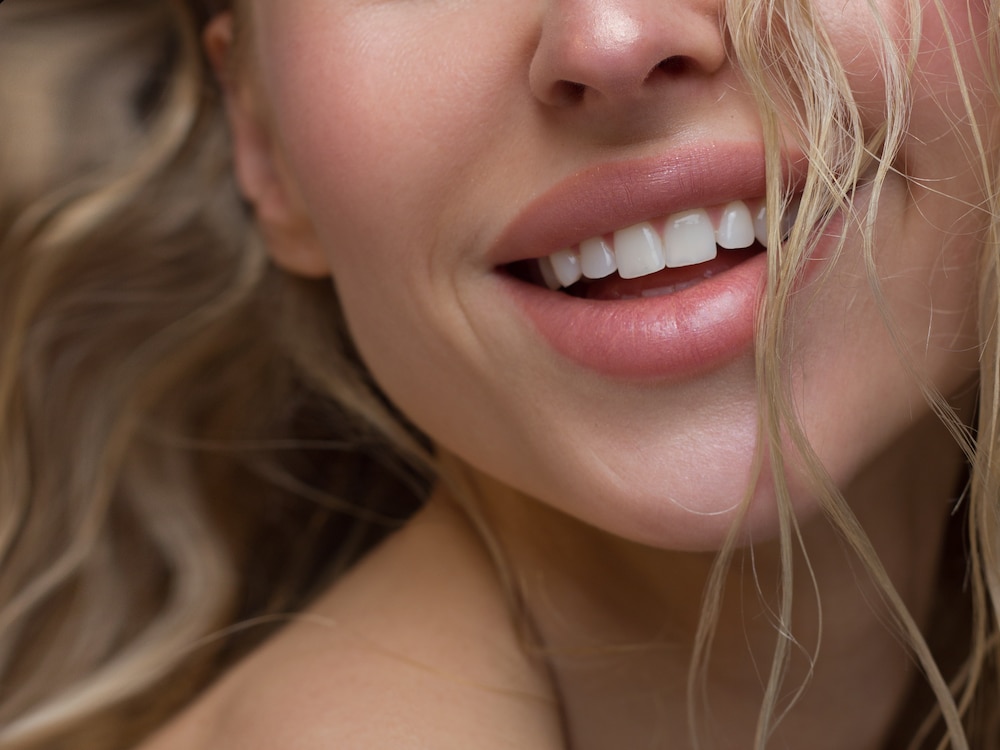 Woman smiling large full lips