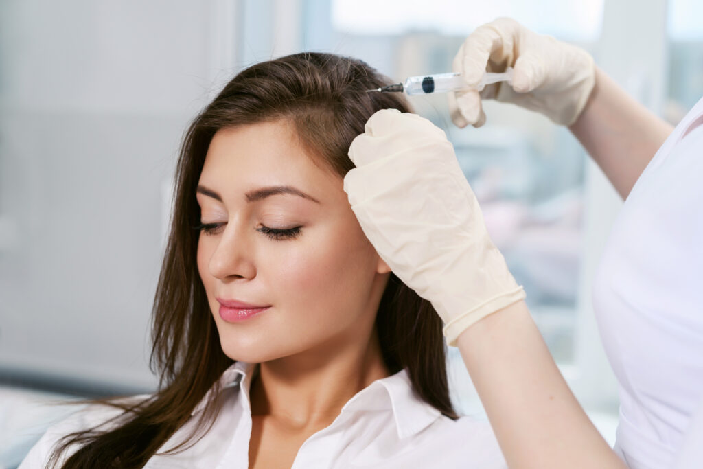 Woman has hair restoration treatment in Lone Tree, CO