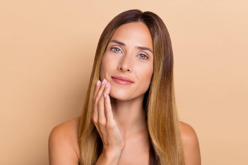Woman with glowing skin after skin rejuvenation treatments with no downtime