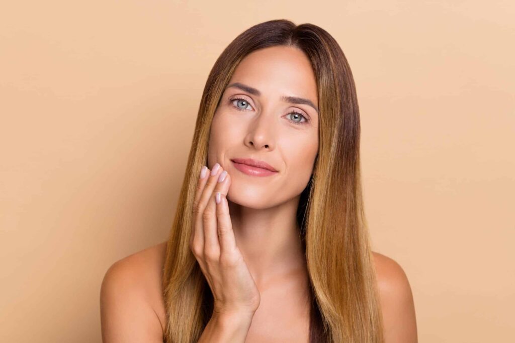 Woman with glowing skin after skin rejuvenation treatments with no downtime