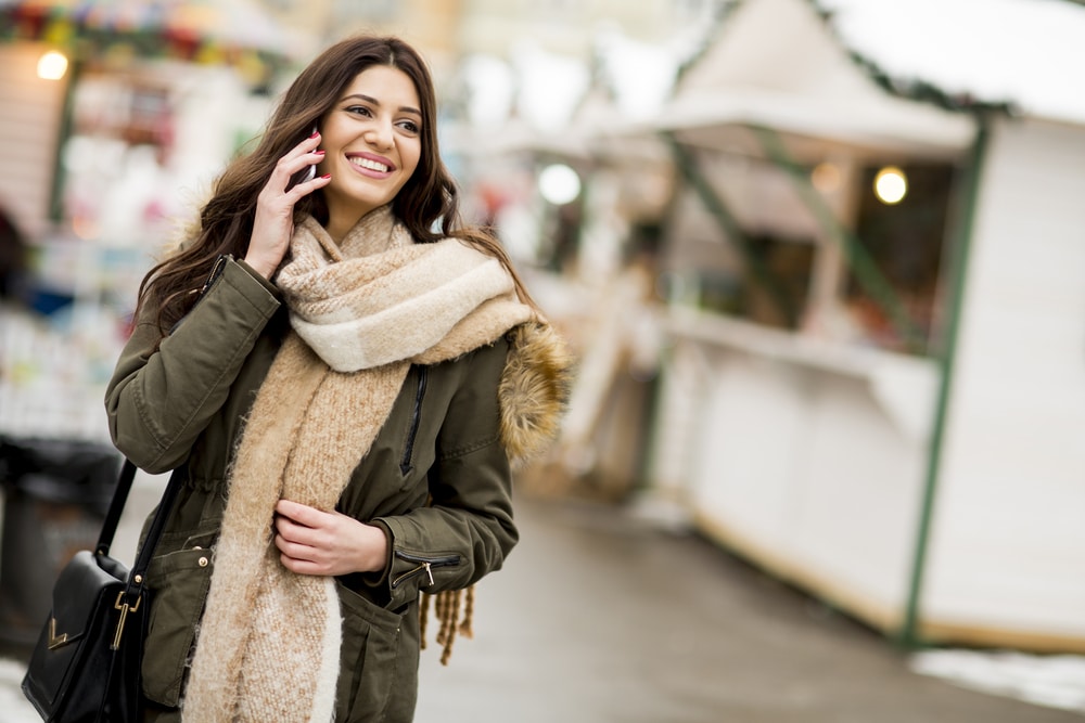 Woman outside in the winter with glowing skin thanks to medical-grade skin care
